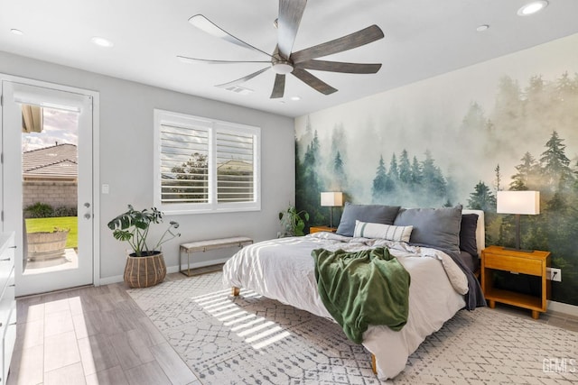 bedroom featuring access to exterior, multiple windows, visible vents, and baseboards