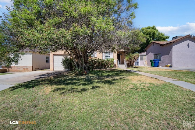 2209 Barnett St, Bakersfield, CA 93308 - view of front of home featuring driveway, a front lawn, and stucco siding