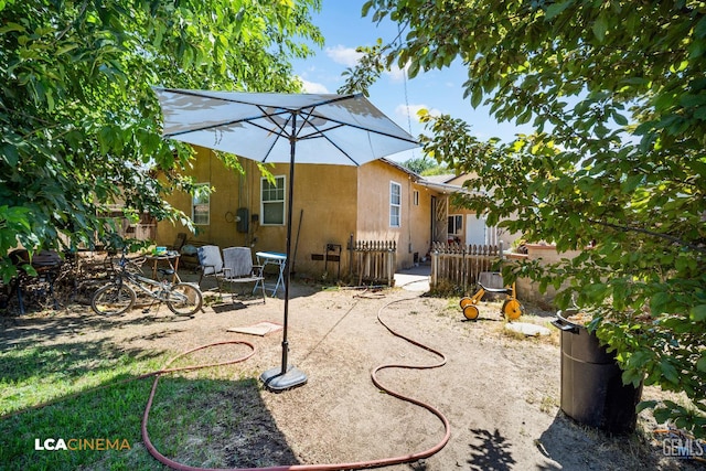 2209 Barnett St, Bakersfield, CA 93308 - rear view of house featuring a patio and stucco siding