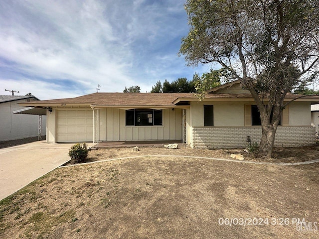 ranch-style house featuring a garage