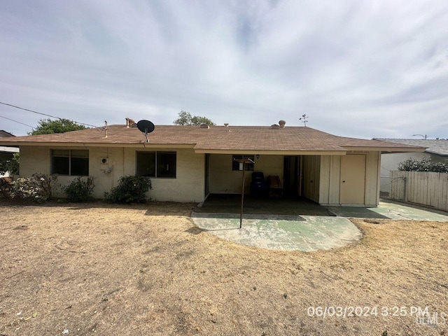 rear view of property with a patio area