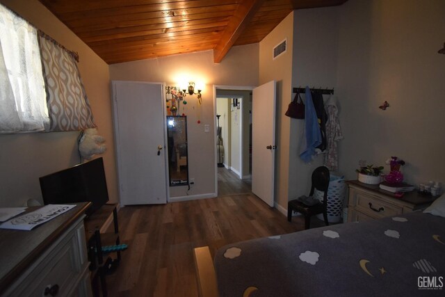 bedroom featuring vaulted ceiling with beams, hardwood / wood-style floors, and wooden ceiling