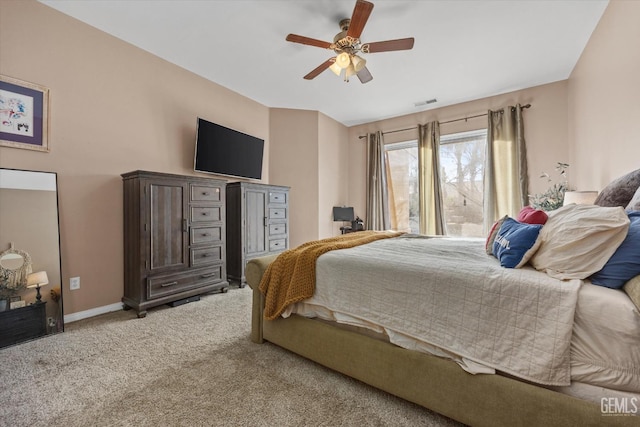 bedroom with ceiling fan and carpet floors