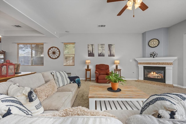 living room with carpet and ceiling fan