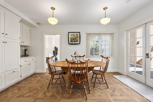 dining area with french doors and baseboards