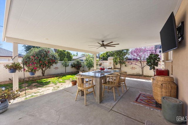 view of patio / terrace featuring outdoor dining area, a fenced backyard, and ceiling fan