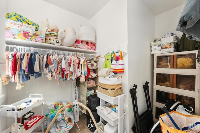 walk in closet featuring carpet