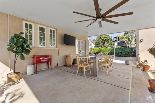 view of patio / terrace featuring a ceiling fan, outdoor dining area, and french doors