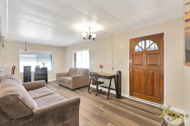 3601 S Chester Ave Unit 12, Bakersfield, CA 93304 - living area featuring a chandelier, light wood finished floors, and a textured ceiling