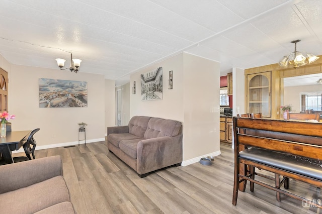 3601 S Chester Ave Unit 12, Bakersfield, CA 93304 - living area with a chandelier and light wood-style floors