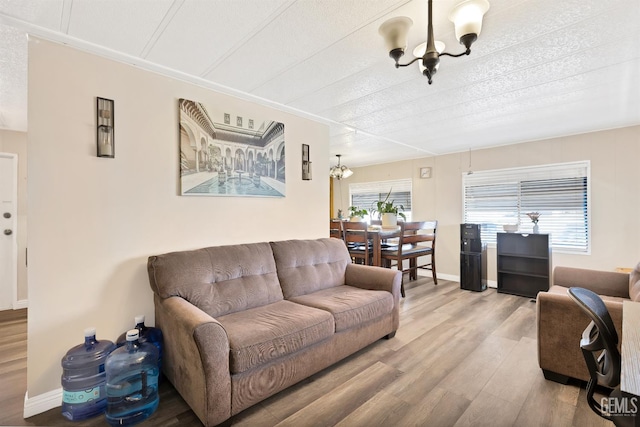 3601 S Chester Ave Unit 12, Bakersfield, CA 93304 - living area featuring a chandelier and wood finished floors