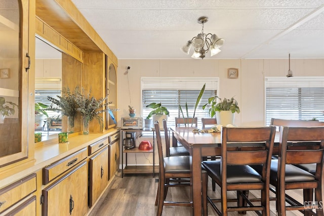 3601 S Chester Ave Unit 12, Bakersfield, CA 93304 - dining room featuring dark wood-type flooring and a chandelier