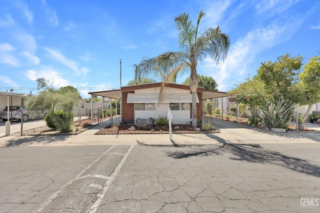 3601 S Chester Ave Unit 12, Bakersfield, CA 93304 - manufactured / mobile home featuring an attached carport and driveway