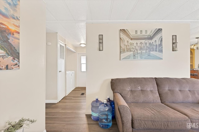 3601 S Chester Ave Unit 12, Bakersfield, CA 93304 - living area featuring wood finished floors and washer / clothes dryer