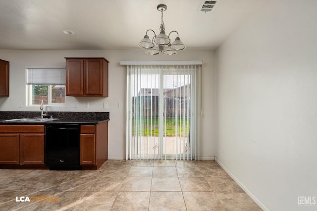 kitchen with sink, decorative light fixtures, dark stone countertops, dishwasher, and a chandelier