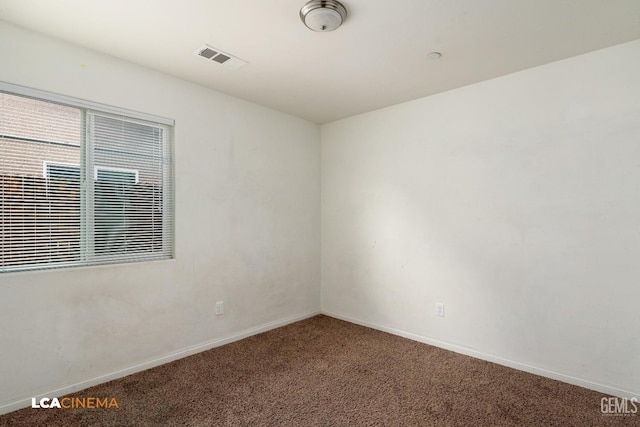 unfurnished room with carpet floors