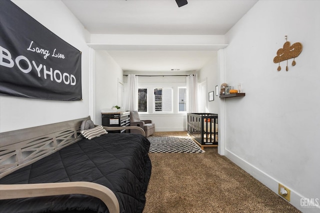 bedroom with carpet flooring and baseboards