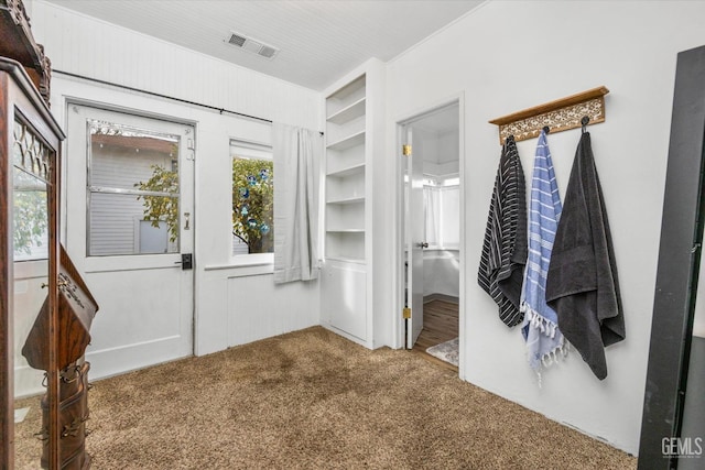 walk in closet featuring carpet floors and visible vents