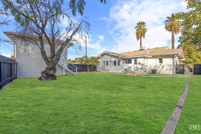 view of yard with a fenced backyard