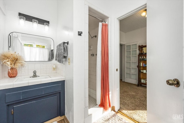 full bath featuring a shower stall and vanity