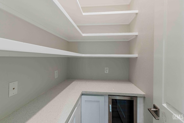 storage area featuring wine cooler
