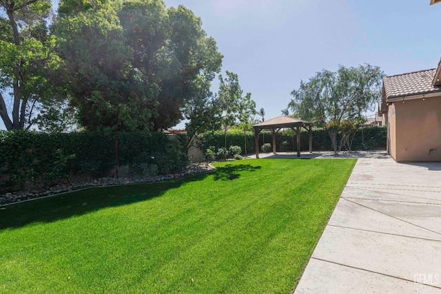 view of yard featuring a gazebo and a patio area