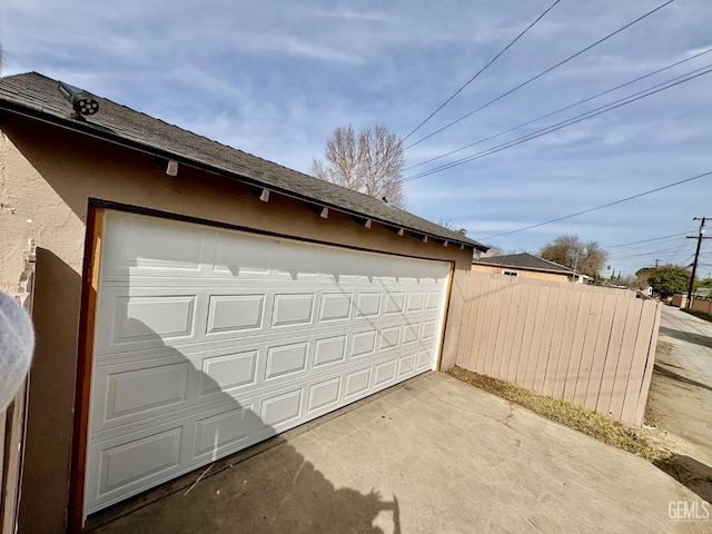 detached garage with fence