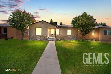 ranch-style house featuring a front lawn, crawl space, and roof mounted solar panels