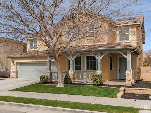 view of front of house with driveway, stone siding, covered porch, a garage, and stucco siding