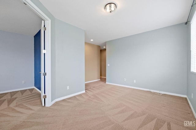 empty room featuring recessed lighting, carpet floors, and baseboards