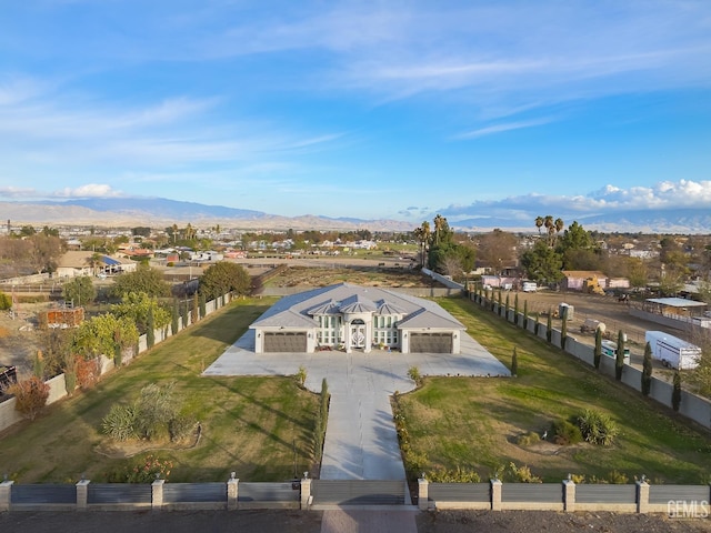 birds eye view of property with a mountain view