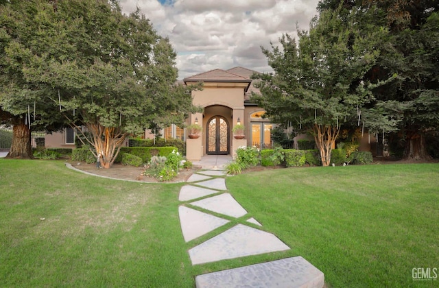 12603 Clay Creek Ct, Bakersfield, CA 93312 - mediterranean / spanish-style home with a front lawn, french doors, and stucco siding