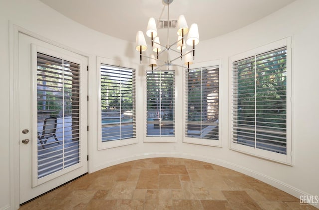 12603 Clay Creek Ct, Bakersfield, CA 93312 - unfurnished dining area featuring stone tile flooring and a chandelier