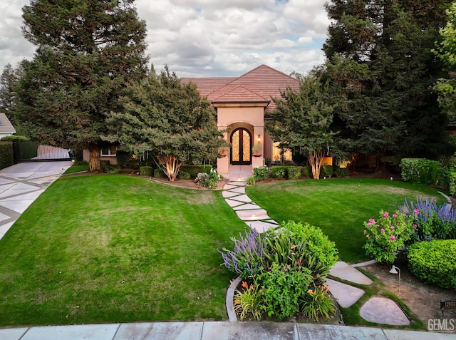 12603 Clay Creek Ct, Bakersfield, CA 93312 - view of front of house featuring a front yard, french doors, a tiled roof, stucco siding, and a gate