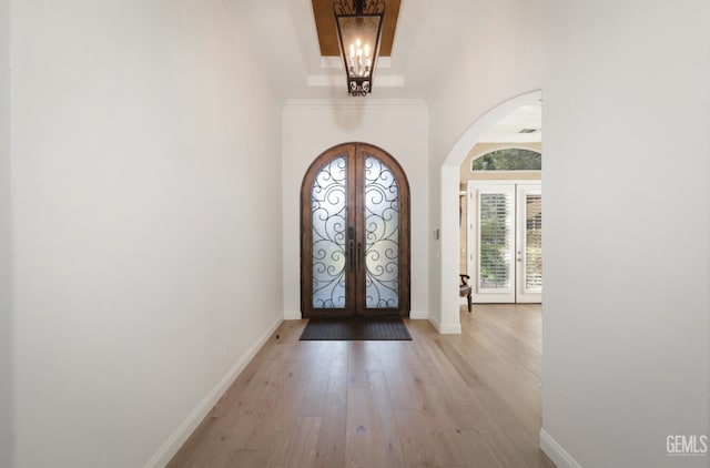 12603 Clay Creek Ct, Bakersfield, CA 93312 - foyer entrance with french doors, arched walkways, and light wood-style flooring