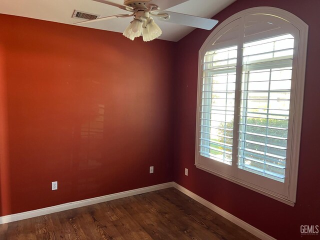 5322 Windriver Dr, Bakersfield, CA 93312 - spare room featuring dark wood finished floors and a ceiling fan