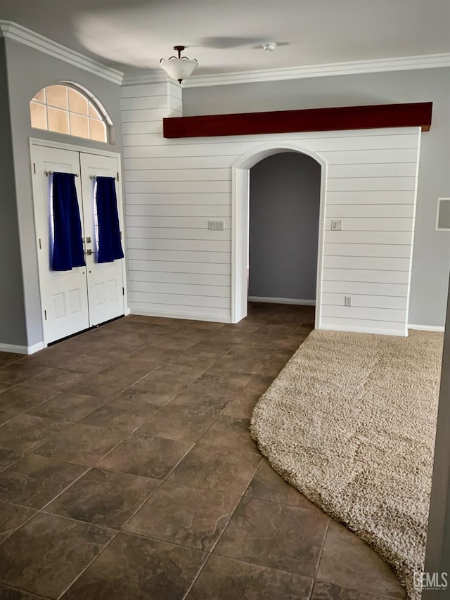 5322 Windriver Dr, Bakersfield, CA 93312 - foyer entrance featuring crown molding, arched walkways, and wooden walls