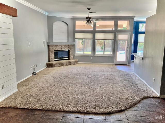 5322 Windriver Dr, Bakersfield, CA 93312 - unfurnished living room featuring carpet flooring, a ceiling fan, crown molding, plenty of natural light, and a brick fireplace