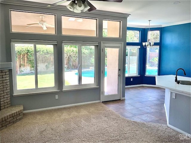 5322 Windriver Dr, Bakersfield, CA 93312 - entryway with a ceiling fan, healthy amount of natural light, ornamental molding, carpet flooring, and a chandelier