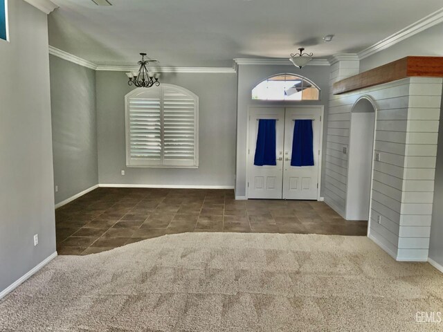 5322 Windriver Dr, Bakersfield, CA 93312 - carpeted entrance foyer featuring a chandelier, ornamental molding, and tile patterned flooring