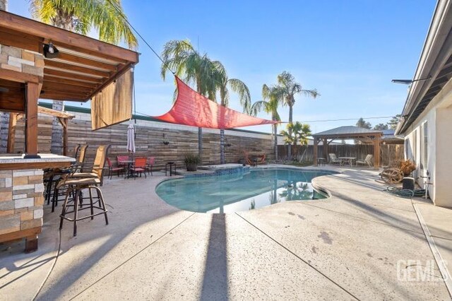 view of patio with a fenced in pool