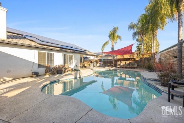 view of pool with a fenced in pool, a fenced backyard, and a patio