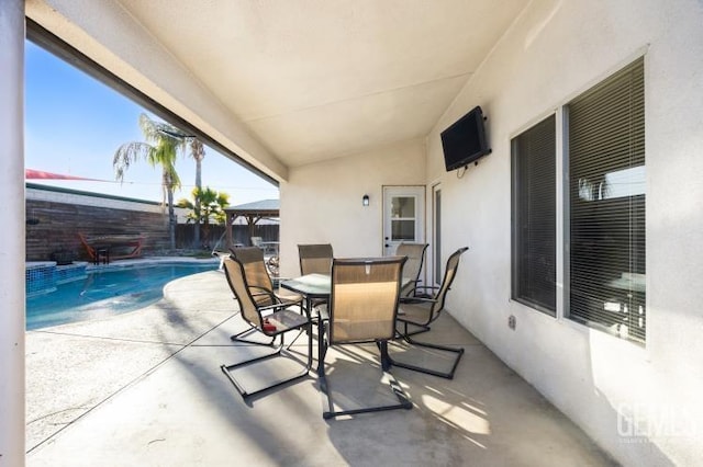 view of patio featuring a fenced in pool