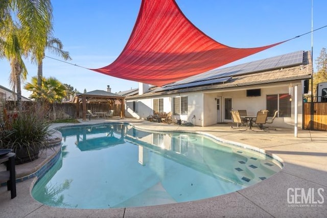 view of swimming pool with a gazebo and a patio