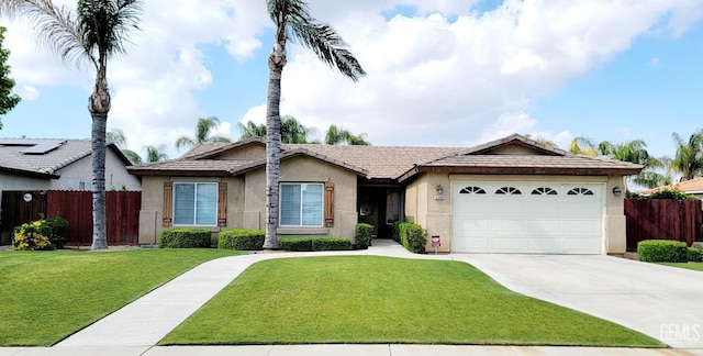 5308 Benevento Ct, Bakersfield, CA 93308 - ranch-style home featuring a tiled roof, concrete driveway, stucco siding, and fence