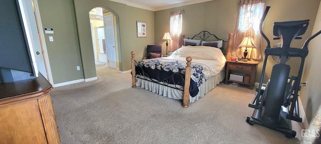 5308 Benevento Ct, Bakersfield, CA 93308 - bedroom featuring light colored carpet, arched walkways, crown molding, and baseboards