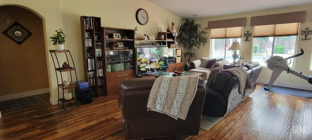 5308 Benevento Ct, Bakersfield, CA 93308 - living area featuring arched walkways, baseboards, and wood finished floors