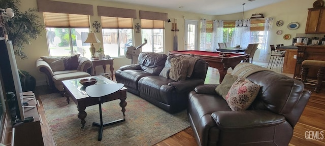 5308 Benevento Ct, Bakersfield, CA 93308 - living area with wood finished floors, billiards, and a healthy amount of sunlight