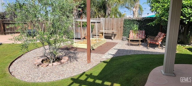 5308 Benevento Ct, Bakersfield, CA 93308 - view of yard featuring a fenced backyard, a garden, and a patio