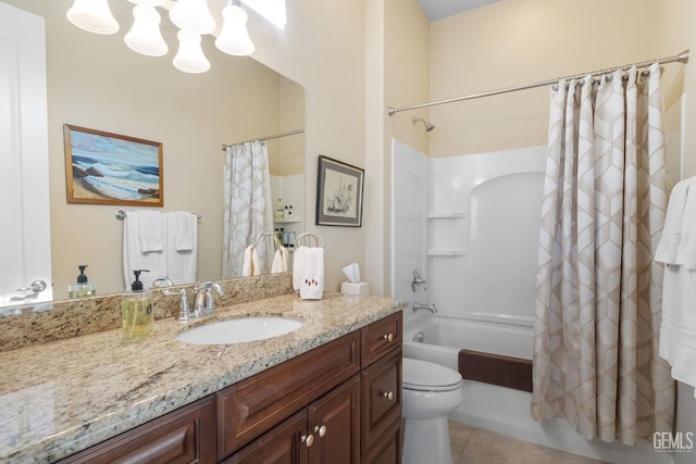 full bath with vanity, shower / bath combo, tile patterned floors, toilet, and a chandelier